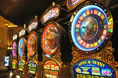 cuantoto live-dealer casino studio with roulette and baccarat tables